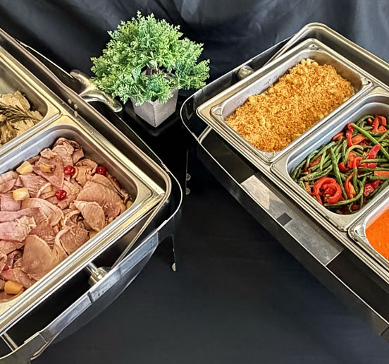 Holiday buffet with ham, vegetables and warm sides